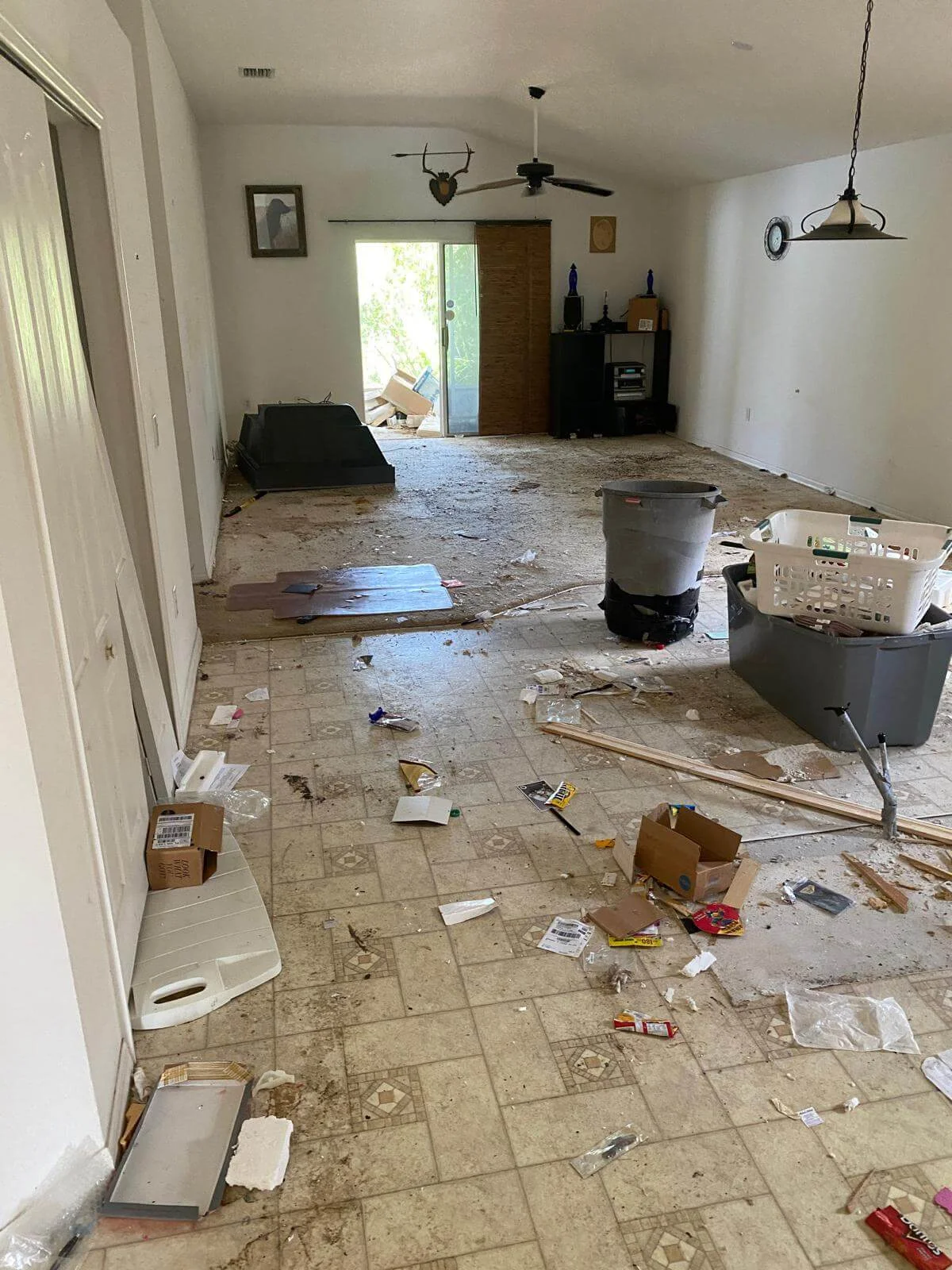 Before — room full of trash and debris